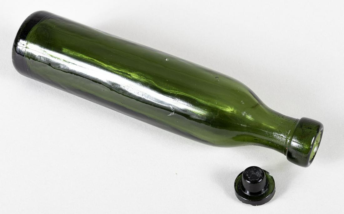 WWI GERMAN GAS BOMB BOTTLE CLARK: Original German gas bottle that contained toxic gas to be used in chemical warfare during 1917. This green glass bottle, 7.5 x 1.75 inches, contained a fluid with a color varying from eggwhite to brow