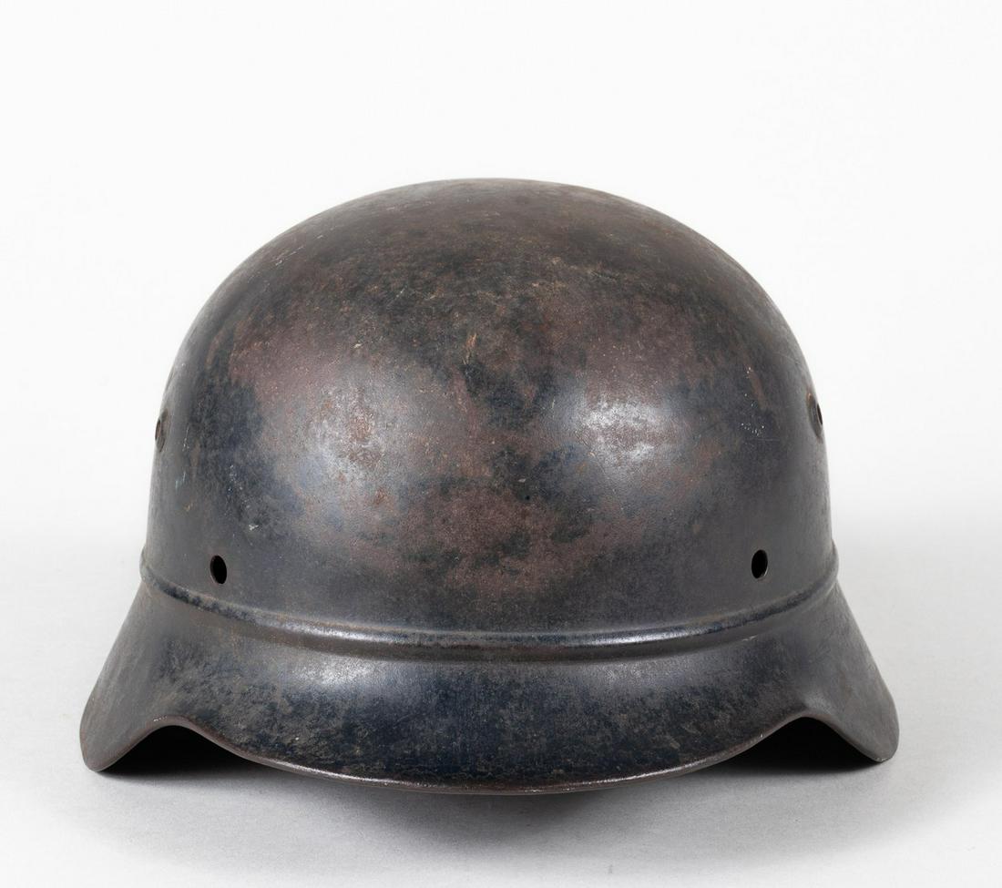GERMAN WWII M35 BEADED HELMET: German WWII beaded M35 helmet in black, no insignias, early inserted vents, marked ET 62 Eisenhuttenwerk Thale Harz, skirt lot number 4272, without liner.