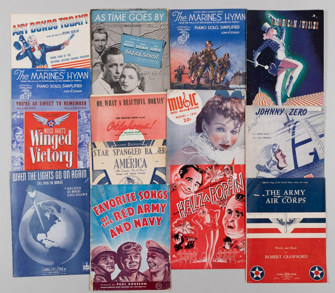WWII PATRIOTIC SONGBOOKS (13): Thirteen American WWII patriotic and homefront songbooks and sheet music from 1939-1944. Includes songbooks for the Marines, Navy, and Army Air Corps, 'Casablanca', 'Oklahoma!', etc. Approx. 12 x 9.5 
