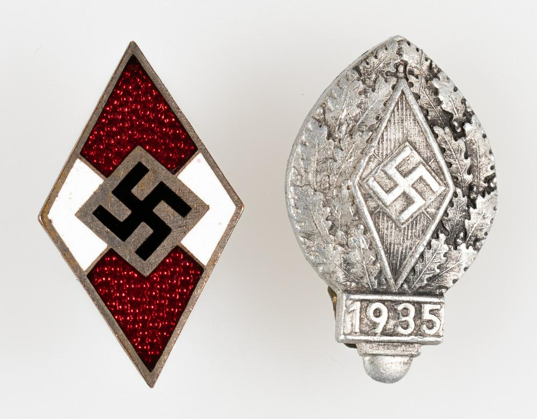 HITLER YOUTH MEMBERSHIP BADGES (2): Lot of two Hitler Youth badges, a membership badge with the maker mark M1/105, and a 1935 Hitler Youth festival badge marked 'Ferd. Wagner Pforzheim.'