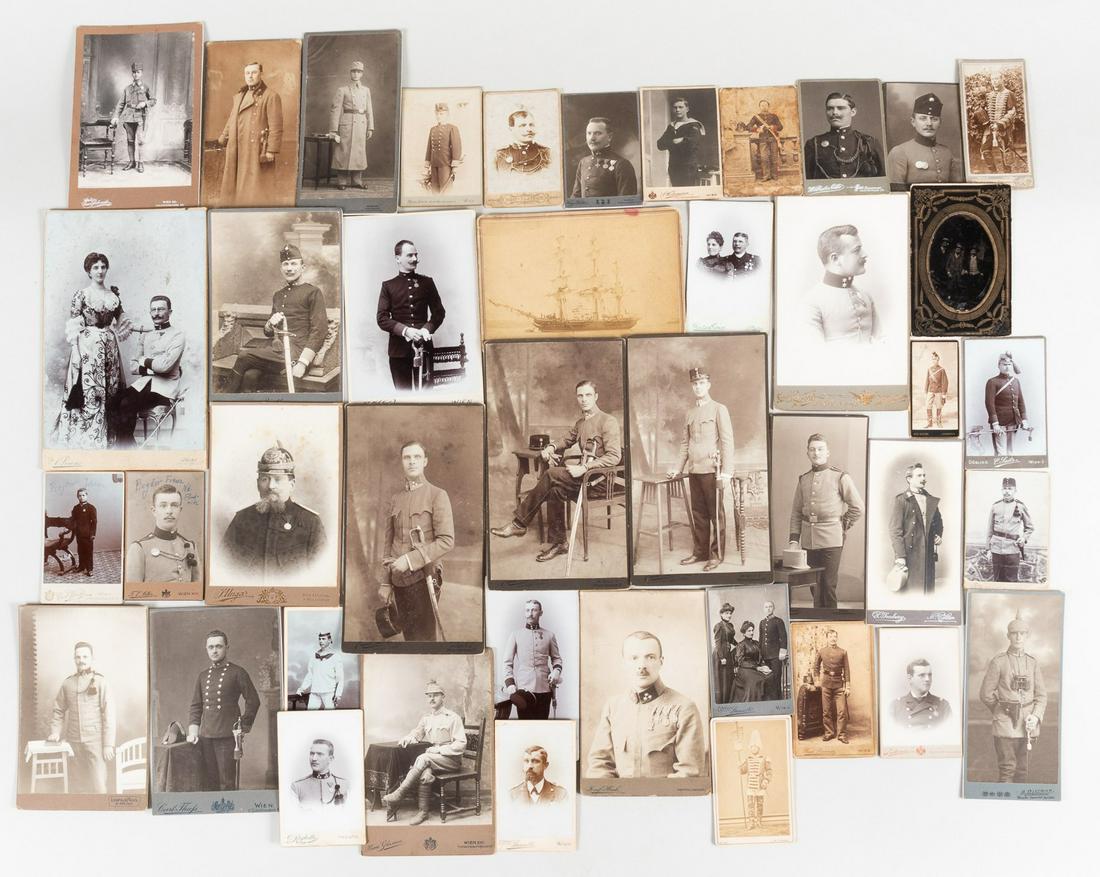 AUSTRO-HUNGARIAN PHOTO CARDS (42): Lot of 42 photo cards from Austria-Hungary likely from the early 1910s to 1920s. Lot includes civilians and soldiers posing in photo studios. Several different photo studios have their names on the ve