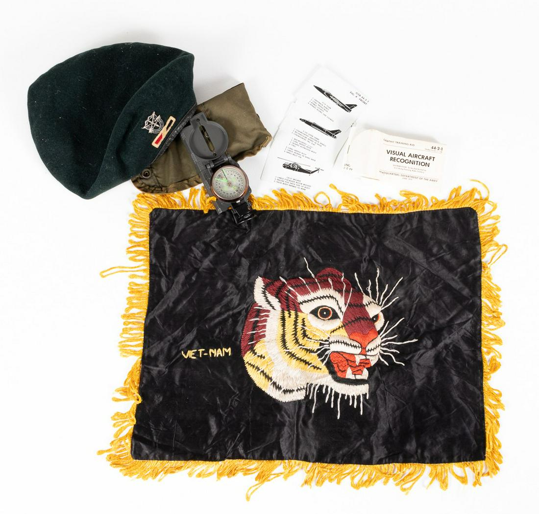 VIETNAM WAR SOUVENIRS (4): Lot of four Vietnam War soldier items. A Green Beret with U.S. Army Special Forces pin, 'De Opresso Liber', compass of unknown origin with pouch, visual aircraft recognition training cards dated June 