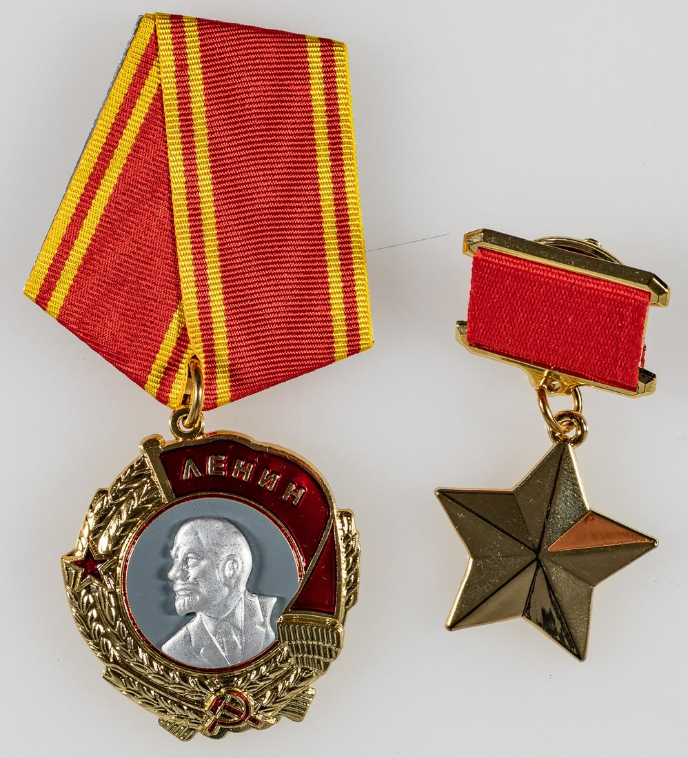 HERO OF THE SOVIET UNION MEDALS: Lot of two Soviet badges, 'The Golden Star', 2.25 inches with ribbon, and the 'Order of Lenin', 3.5 inches with ribbon. Wearer's copies.