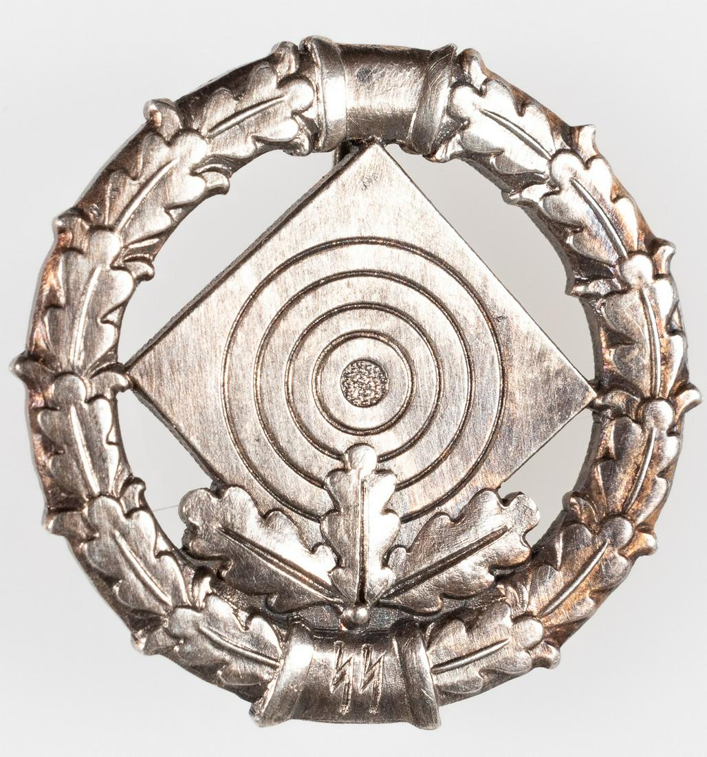SS SHOOTING BADGE WITH THREE LEAVES: SS Shooting Badge of the highest reward with a target, three oak leaves, and an oak leaf wreath. Marked 'SS' on front and verso. Verso has 'Otto Gahr' design mark with 'SS' and 'Ges. Gesch.' Sold as-i