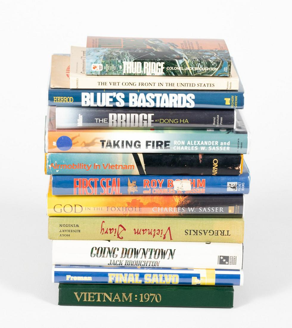 VIETNAM BOOKS (12): Lot of twelve books about the Vietnam War. Some books are signed by their authors like Charles W. Sasser, Randall Herrod, Jack Broughton, and D.L. Froman.