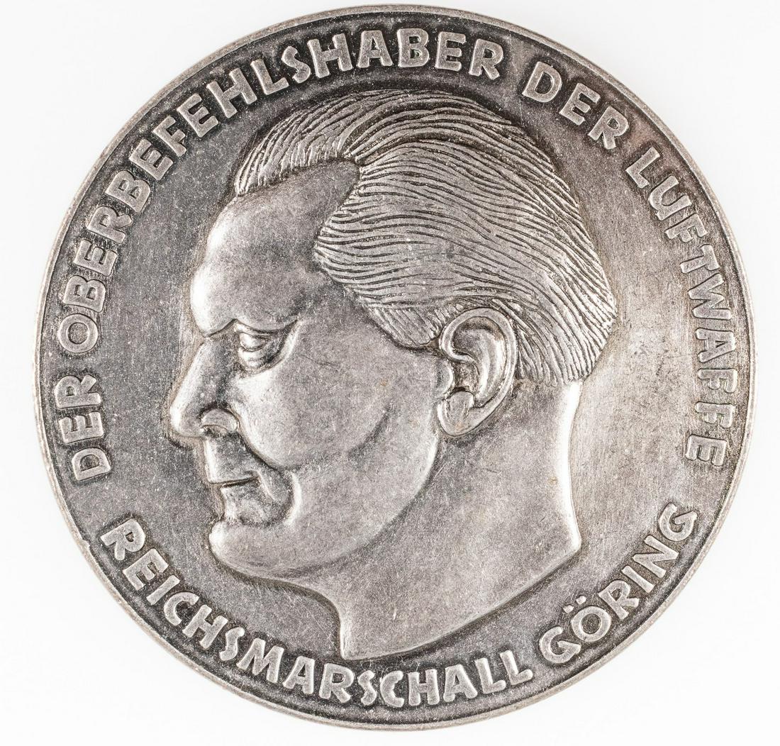 HERMANN GORING SILVER LUFTWAFFE MEDAL: German WWII award for a member of the Luftwaffe, a table medal bearing the profile of Hermann Goring on the obverse, marked 'Der Oberbefehlshaber der Luftwaffe Reichsmarschall Goering' (The Supreme Co