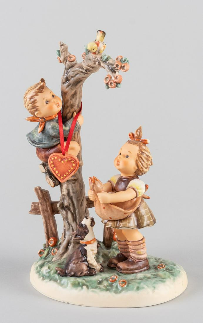 GOEBEL HUMMEL 'HERES MY HEART' #766: Hummel Century Collection 'Here's My Heart'. It comes with a small heart-hanging ornament. Number 766, painted mark by the artist, 'W97'. With the original box and certificate.