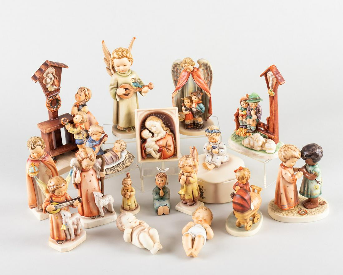 17 GOEBEL HUMMEL FIGURINES: Large group of seventeen Goebel Hummel figurines, including 'Adoration 23/3', 'Music Box #1491', 'Friends Together #104', 'Echoes of Joy #1190', and others.