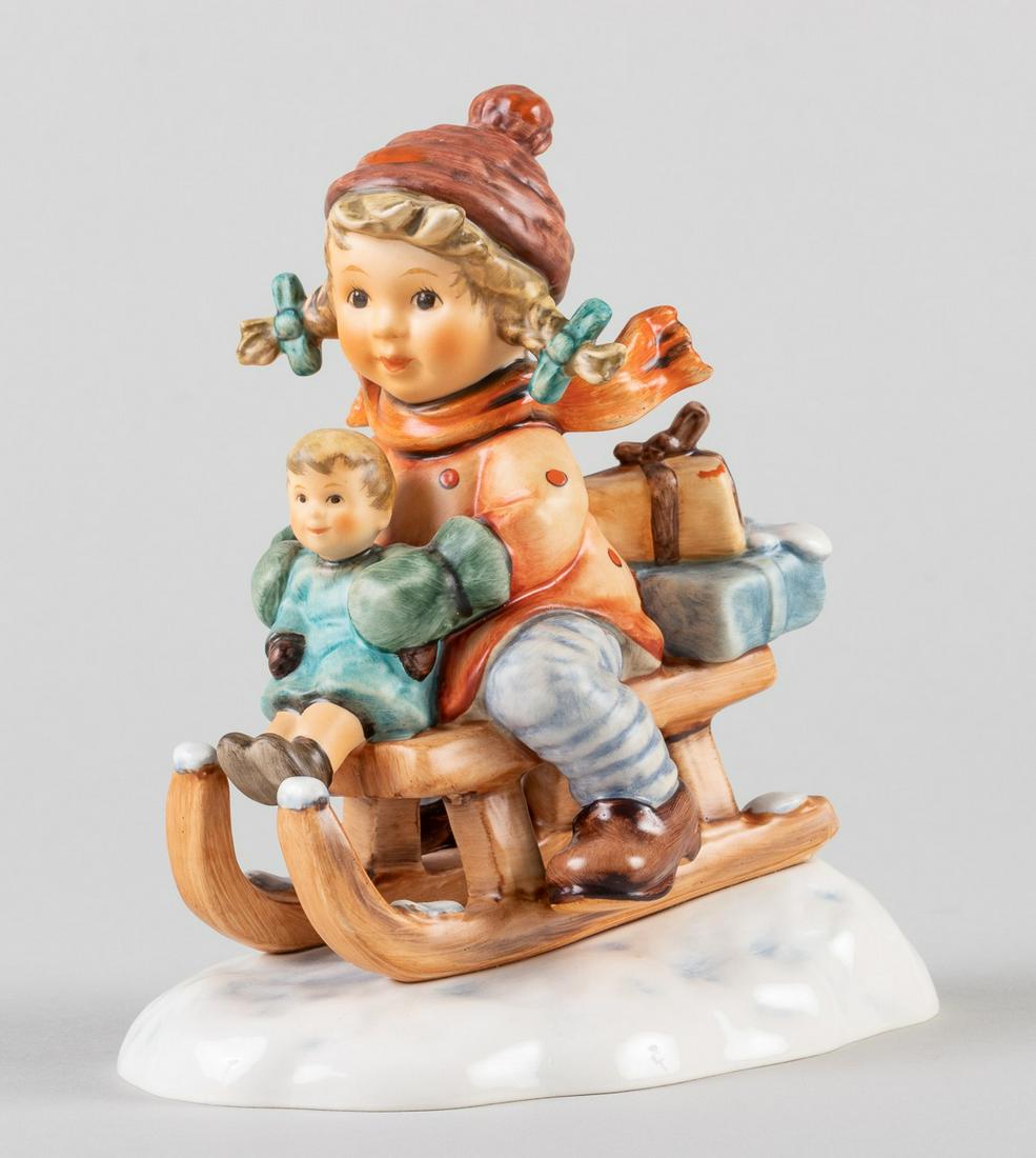 GOEBEL HUMMEL CHRISTMAS DELIVERY: 'Christmas Delivery' Hummel, marked #2014/I, handcrafted and hand-painted. Lot includes the original paperwork and box.