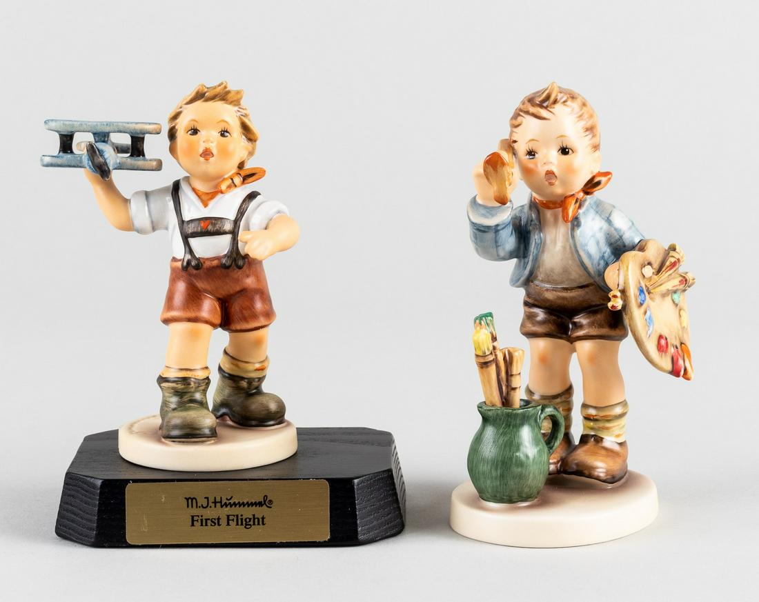 GOEBEL HUMMEL FIRST FLIGHT & THE ARTIST: Lot of two Goebel Hummel figurines: 'First Flight #460', special commemorative edition for the 100th anniversary of aviation. Hand-painted signature by Michaela Goubert, the artist. With the original