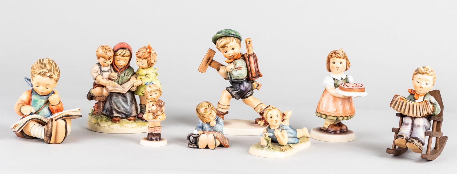 8 GOEBEL HUMMEL FIGURINES: Lot of eight Goebel Hummel figurines, including Miss Beehaving #1619, A Nap #213, Storybook Time #458, Cuddles #1309, Thoughtful #415, Shepherd Standing #205, Practice Makes Perfect #1031, and The Arc