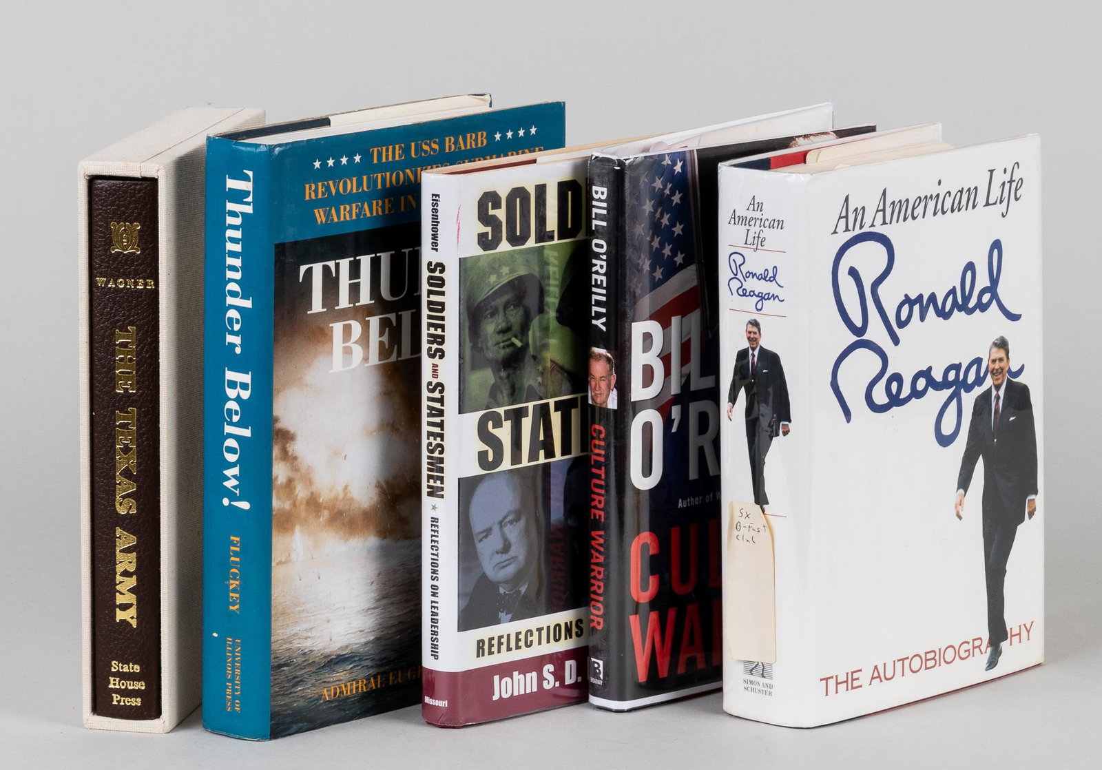 SIGNED POLITICAL BOOKS (5): Lot of five books written by leading political, martial, or cultural figures. Books signed by Bill O'Reilly, John S.D. Eisenhower, Admiral Eugene B. Fluckey, and Robert L. Wagner. 'Reagan' book has st