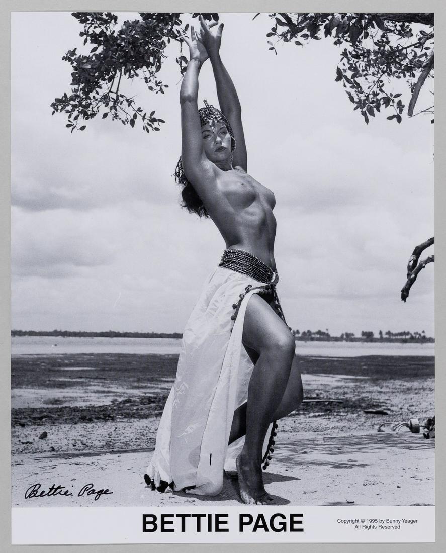 BETTIE PAGE SIGNED PHOTO: (1923-2008) American model, the 'Queen of Pinups' who gained notoriety in the 1950s for her pin-up photos. Signed black-and-white photo print shot by Bunny Yeager, 8 x 10 inches. Very good.