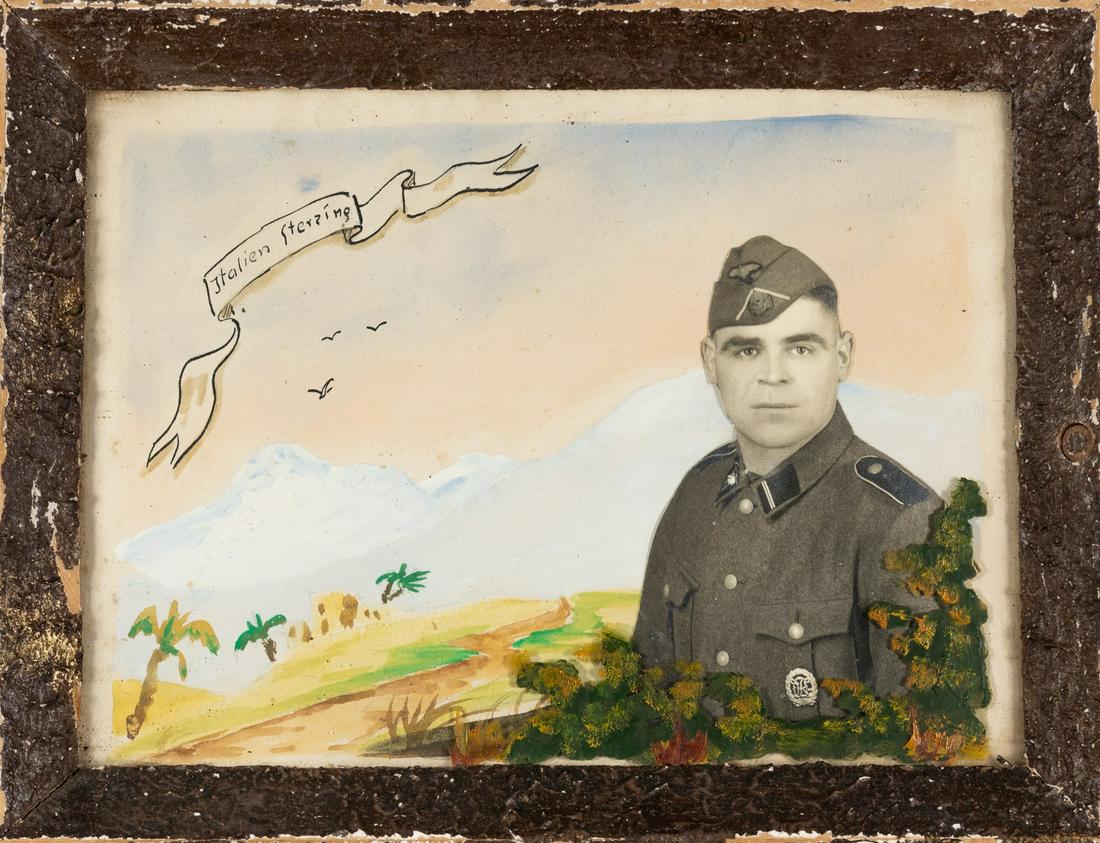 WAFFEN-SS SOLDIER PORTRAIT PHOTOGRAPH: Portrait photograph of a Waffen-SS soldier in uniform, with hand-painted ribbon 'Italien Sterzing', in original frame, visible area 6.5 x 9 inches, overall size 8.25 x 10.5 inches. Some loss of paint 