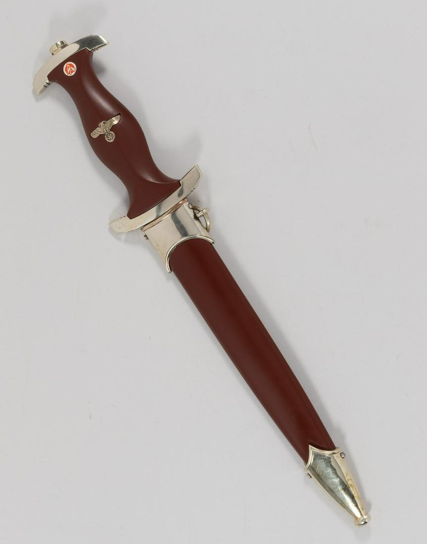 GERMAN SA DAGGER BOKER SOLINGEN: German WWII SA dagger Boker Solingen postwar production. Wood grip with Nazi eagle with the SA enamel emblem and chrome plated crossguard. The blade is etched with the motto 'Alles Fur Deutschland' an