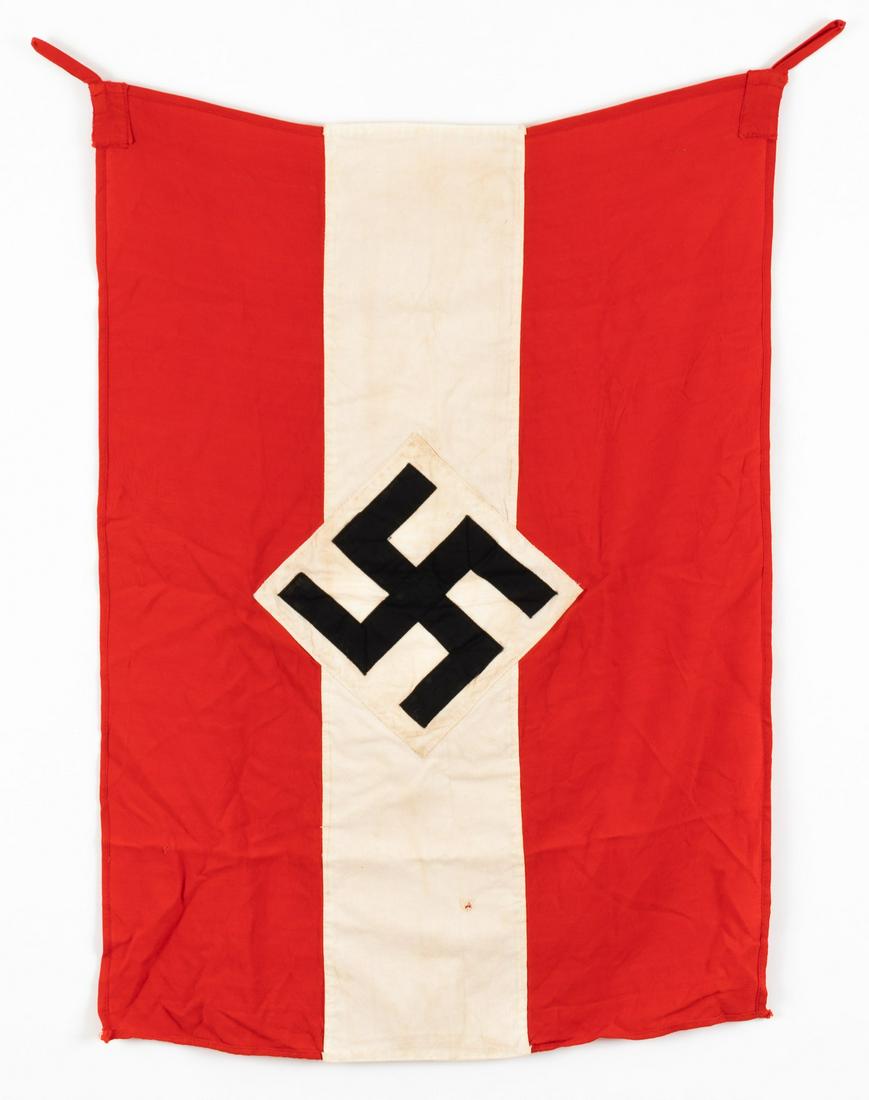 WWII GERMAN HITLER YOUTH FLAG: Double-sided WWII German Hitler Youth / Hitler Jugend flag, multi-piece construction of two red stripes and one white cloth stripe, a mobile black swastika sewn to a white ground. Two red loops are se