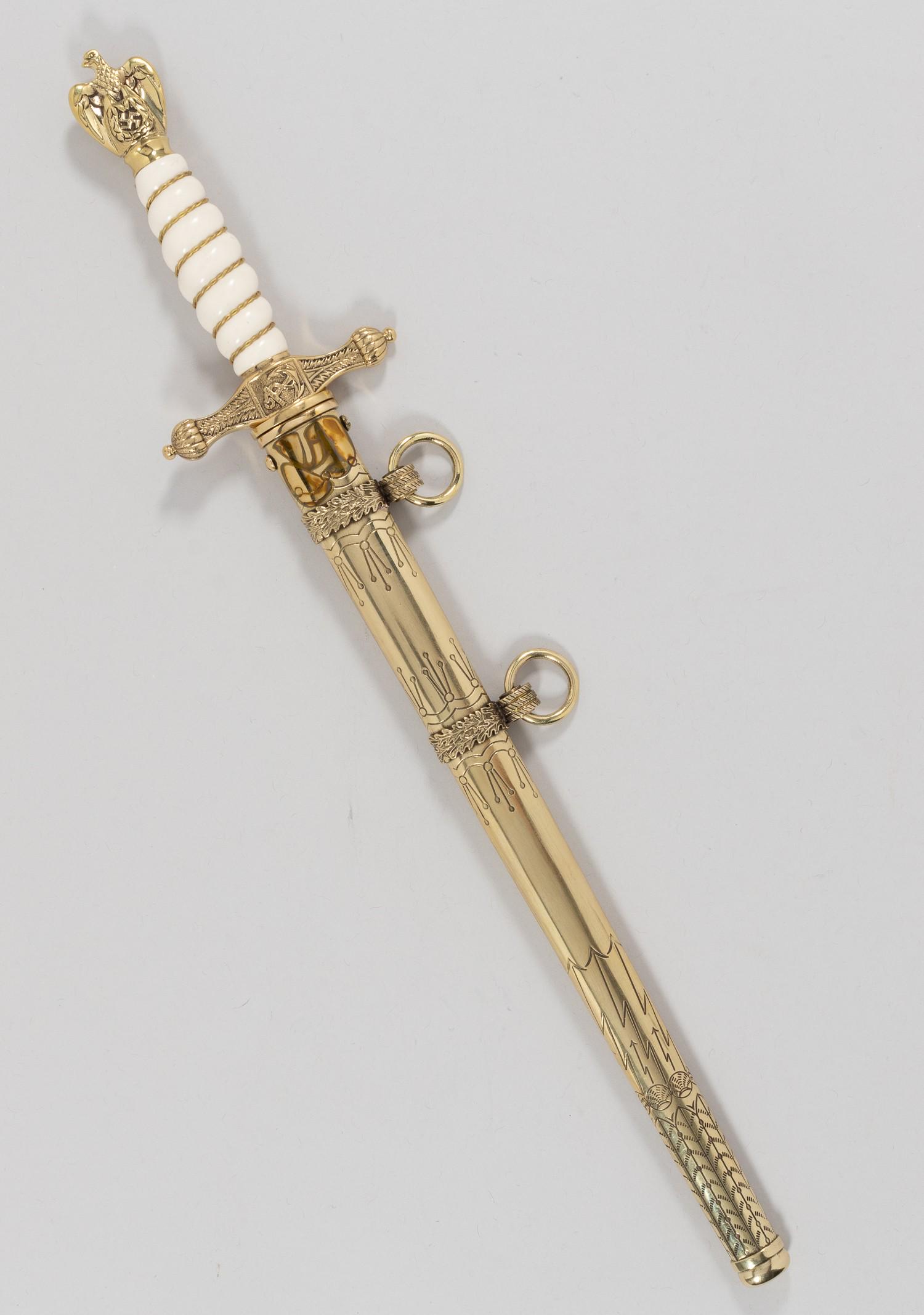 GERMAN WWII KRIEGSMARINE DAGGER: German WWII Kriegsmarine dagger E. Bonsmann postwar production. White grip with wire braiding and gold colored plated Kriegsmarine eagle pommel and crossguard. The blade is etched with fouled anchors 