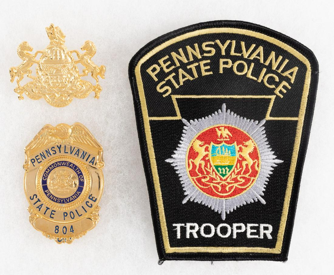 PENNSYLVANIA STATE TROOPER BADGES: Badges for Pennsylvania State Trooper, cap badge is screwback, trooper badge is pinback and numbered '804' on obverse, unmarked on verso. Includes Pennsylvania State Trooper patch.