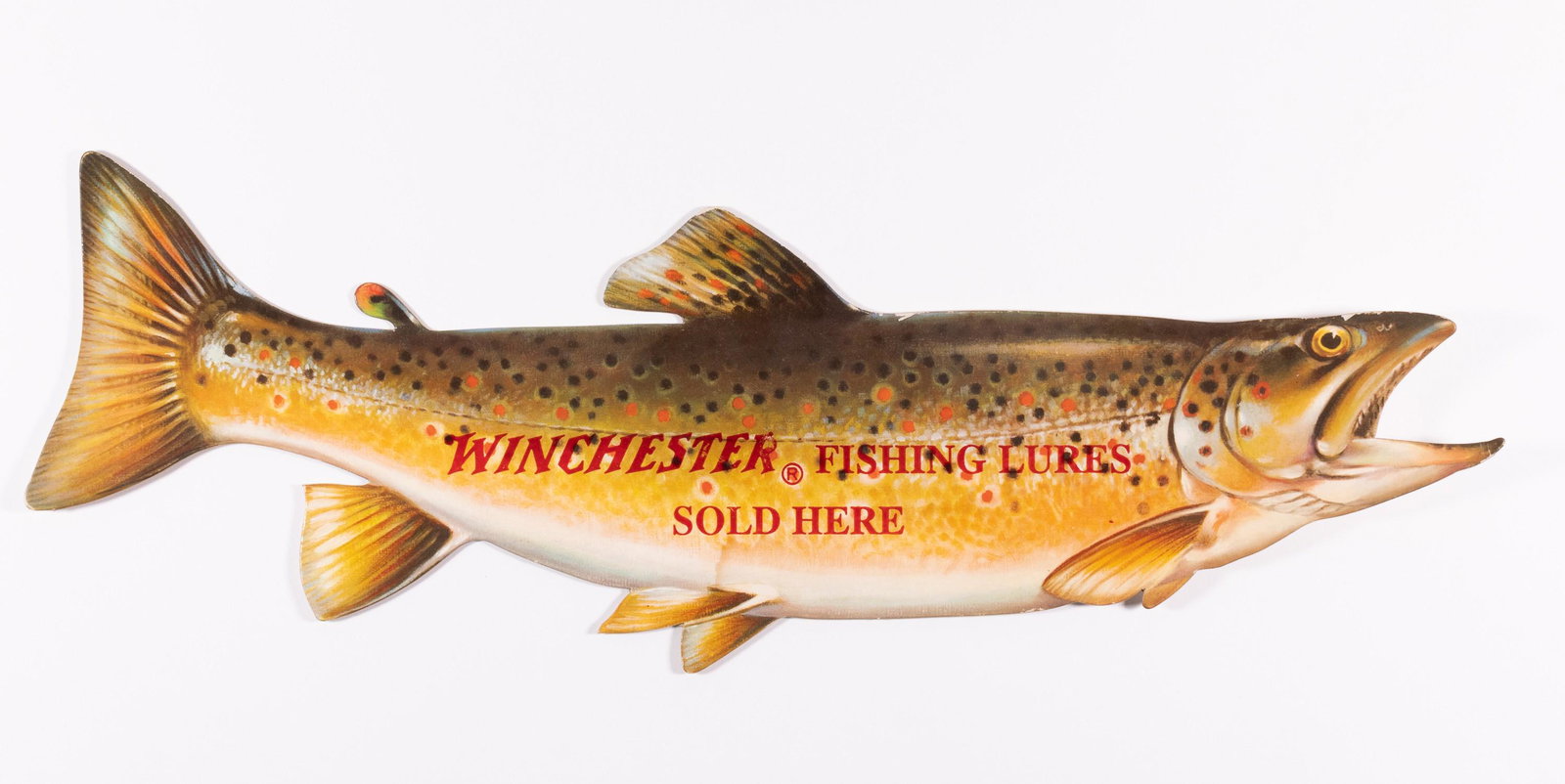 WINCHESTER FISHING LURES DIE CUT ADVERTISEMENT: Winchester die cut advertising sign reading 'Winchester Fishing Lures Sold Here', a multi-colored image of a trout. Printed on cardboard. Very light wear at some edges, minor stain on the bottom. 7 x 