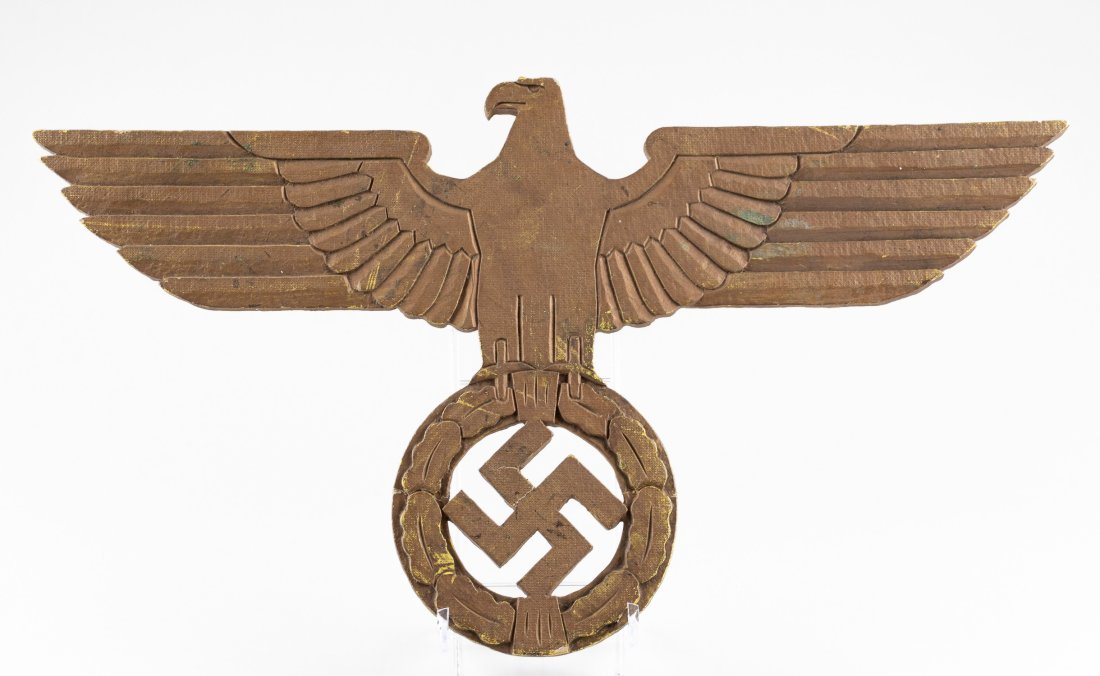 ORIGINAL WWII THIRD REICH GERMAN NAZI EAGLE: Original Third Reich gold painted Nazi eagle, probably made of paper mache or some type of hard cardboard. The eagle still has the original makers label on the back 'Hermann Hollnack, Berlin - Sculptu
