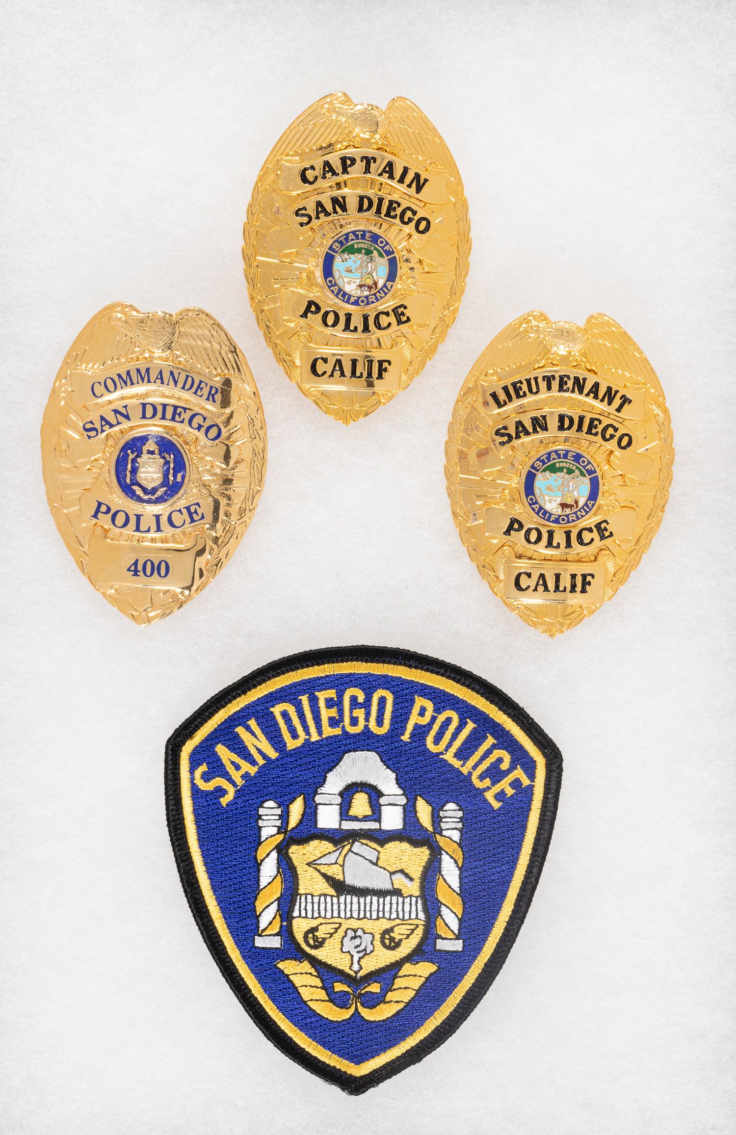 CALIFORNIA SAN DIEGO POLICE BADGES: Badges of the San Diego Police Department, pinbacks, unmarked, one badge numbered on obverse '400'. Includes patch for San Diego Police.