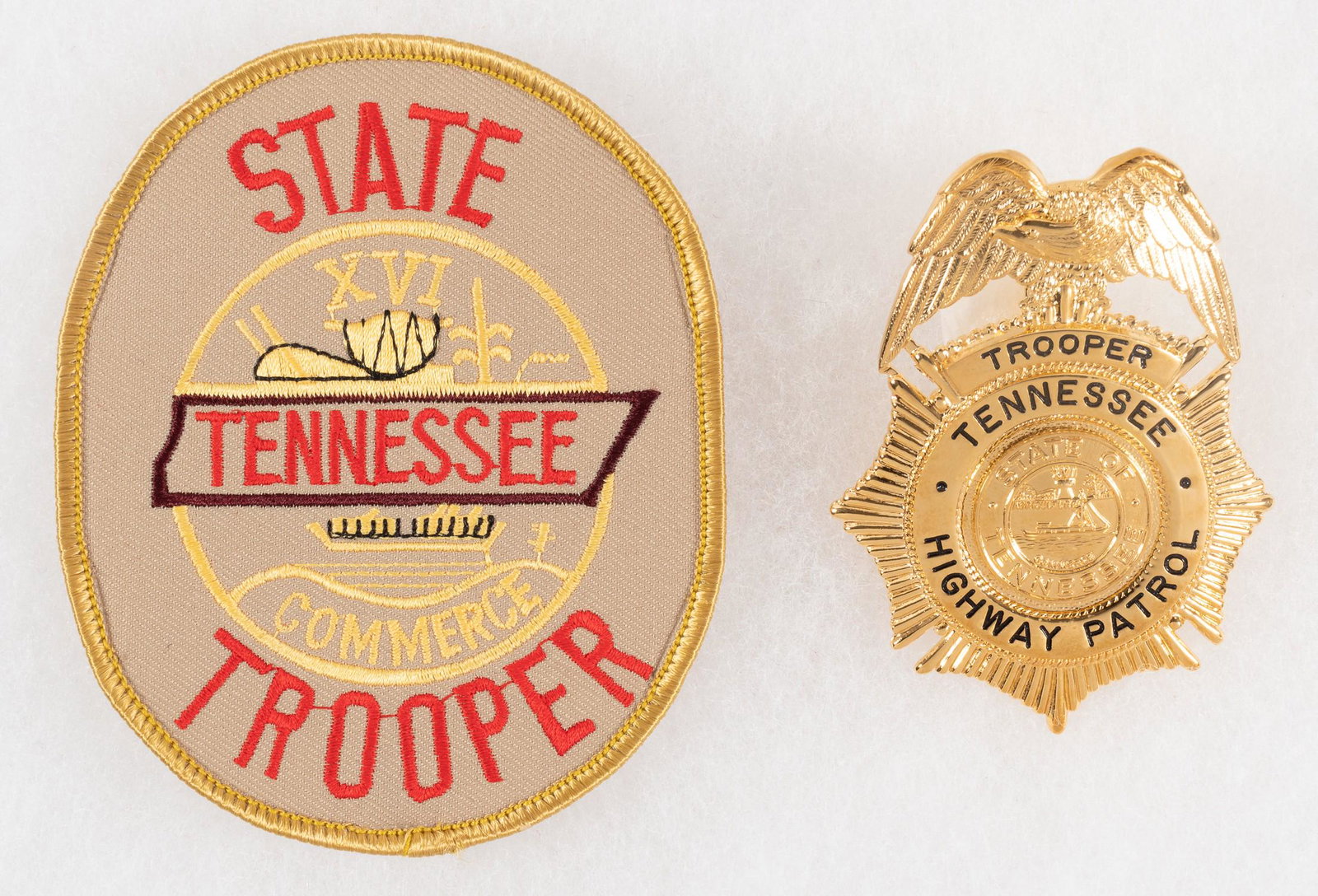 TENNESSEE HIGHWAY PATROL BADGE: Badge of the Tennessee Highway Patrol, pinback, marked on verso 'Blackinton'. Includes patch of Tennessee State Trooper.
