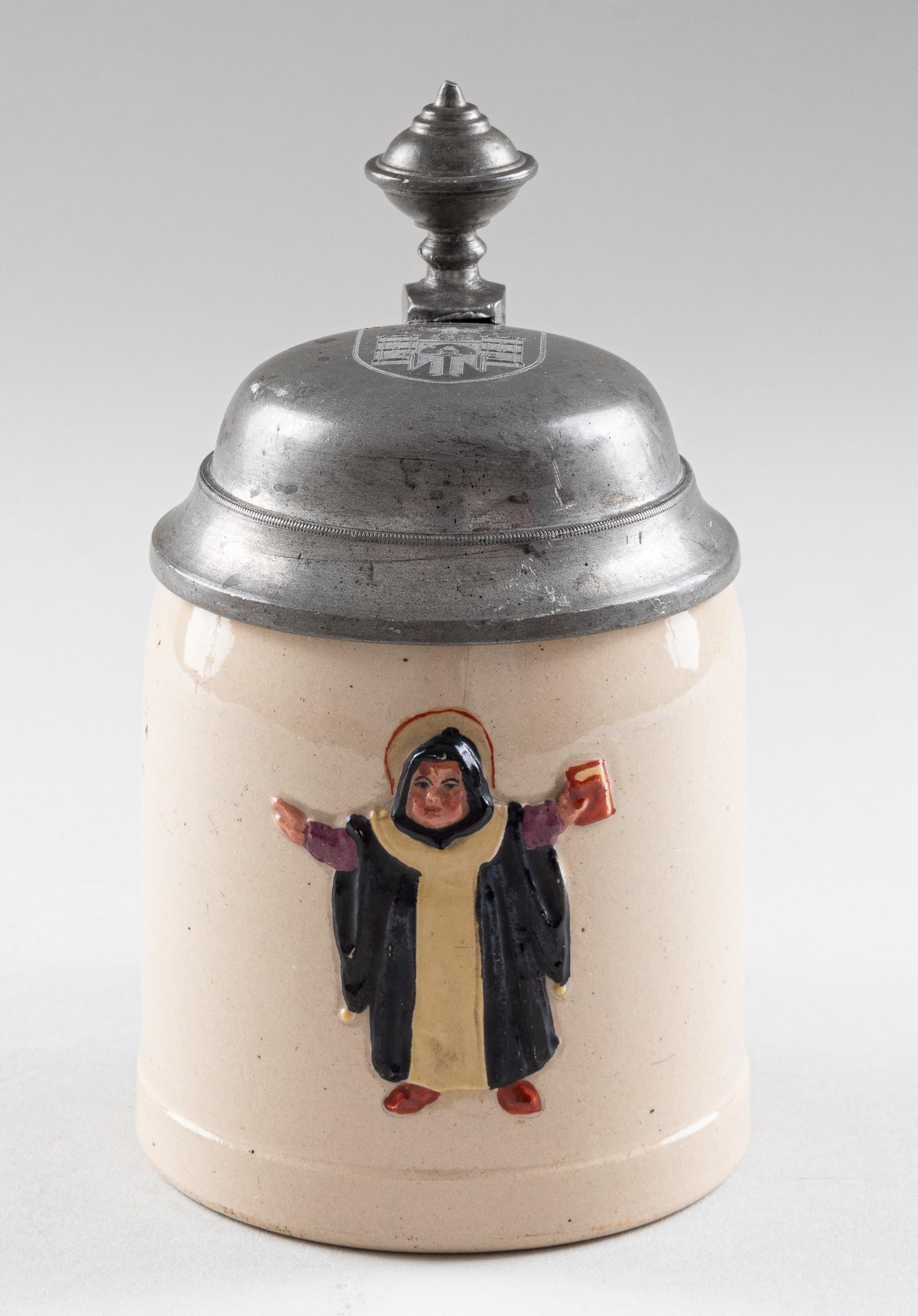 THIRD REICH MUNICH BEER STEIN: Third Reich German WWII beer stein decorated with the Munich Kindl. The lid of beer stein shows the coat of arms of Munich with a Reichs eagle. Opening approx. 2.75 inch diameter, approx. 6 inches tal