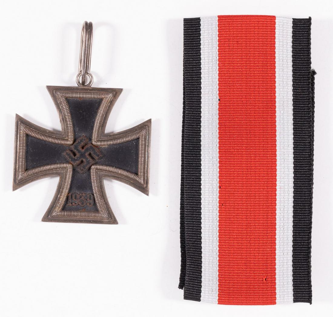 POST-WAR WWII KNIGHTS CROSS OF THE IRON CROSS: Post-war made WWII German Knights Cross to the Iron Cross. The suspension loop is marked '800'. Three Piece construction with an iron magnetic center. The front shows a swastika in the center with the