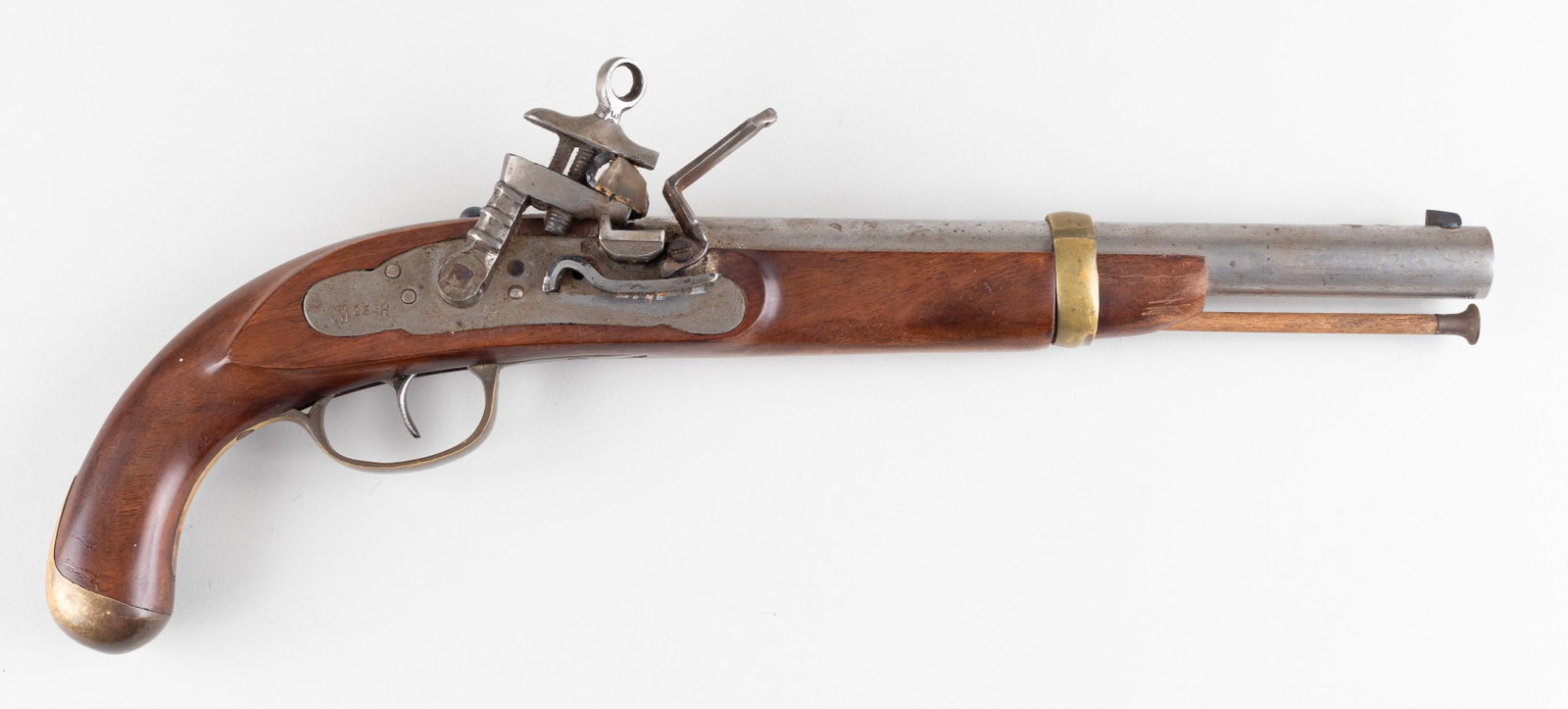 FLINTLOCK PISTOL: Flintlock pistol made in Belgium. The pistol is made of brass, iron, and wood. Stamped with the Liege ELG proof mark inside an oval. Stamped '16.8', ca. .66 cal, serial marked 264H. Brass barrel loop 