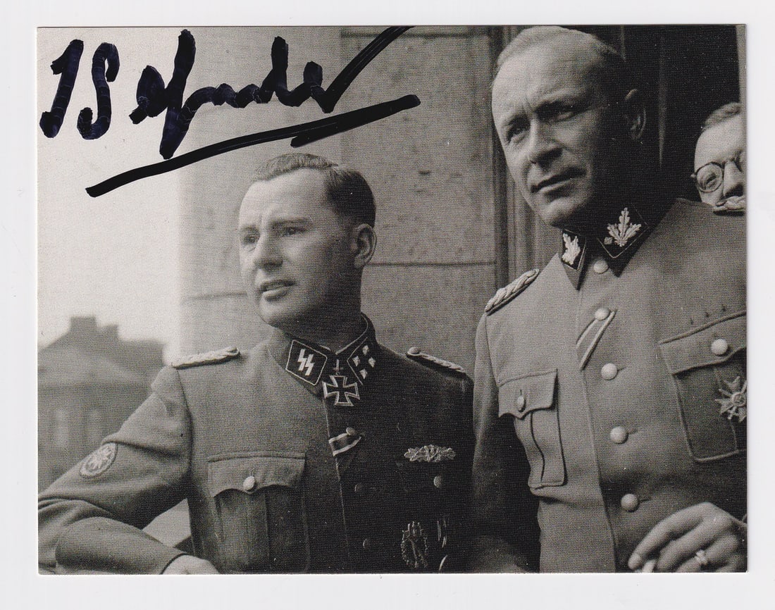 LEON DEGRELLE: (1906-1994) Belgian politician, SS-Standartenfuhrer, political leader of the Walloon Legion, recipient of the Knight's Cross of the Iron Cross with Oak Leaves. Signed photograph, Degrelle is on the le
