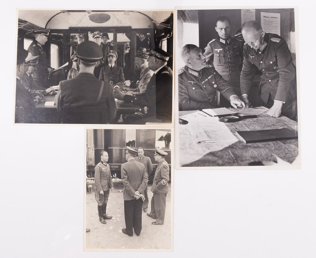 3 GERMAN WWII COMMAND TRAIN PRESS PHOTOGRAPHS: Three WWII German command train press photographs, two photographs are by Heinrich Hoffmann (1885-1957). Hoffmann's photographs show German military members on a command train meeting during the invas