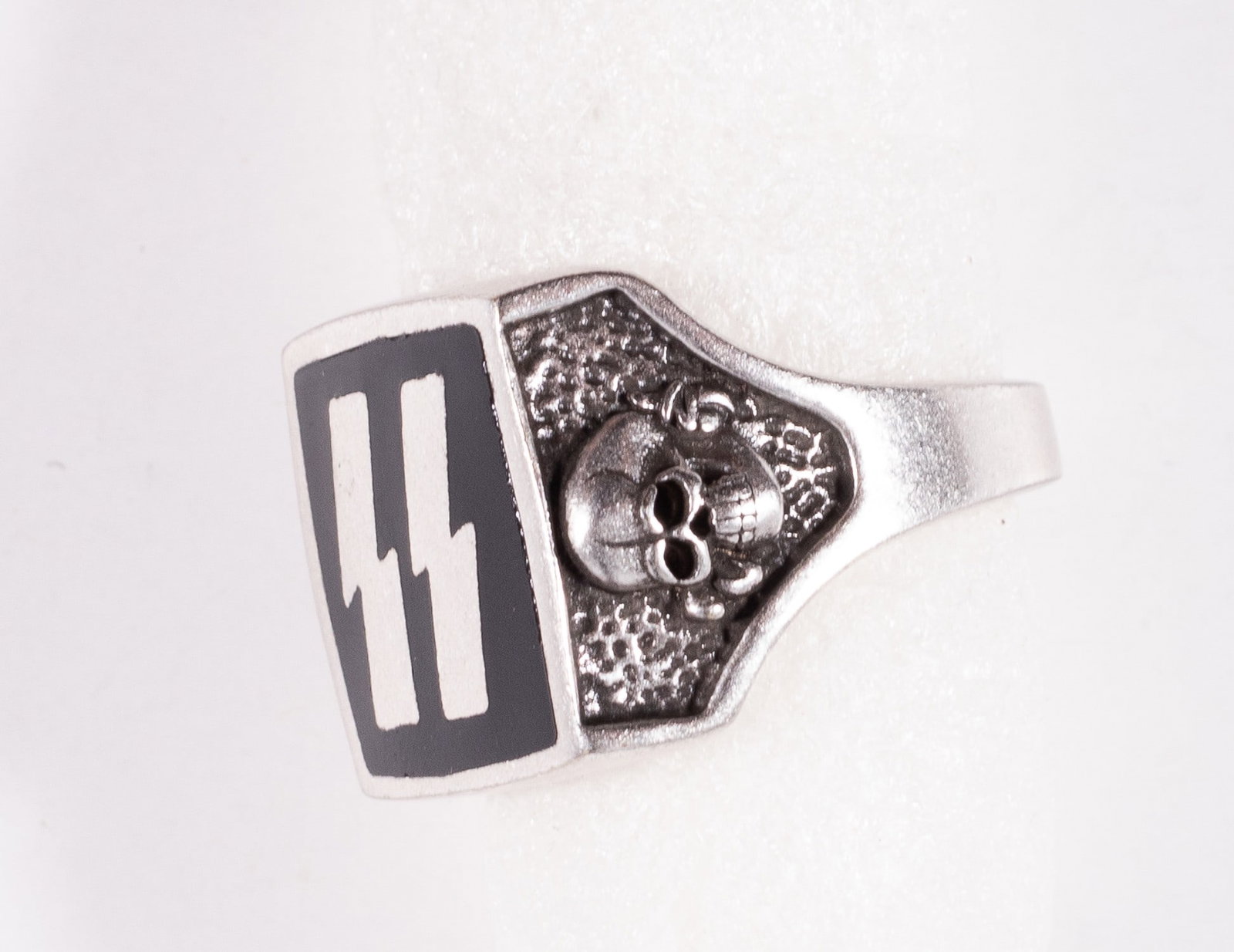 WAFFEN-SS RING: Custom made silver Waffen-SS ring, black enamel with 'SS' runes and skulls on each side, not marked, outside diameter 23mm, inside diameter 20mm. Made post war.