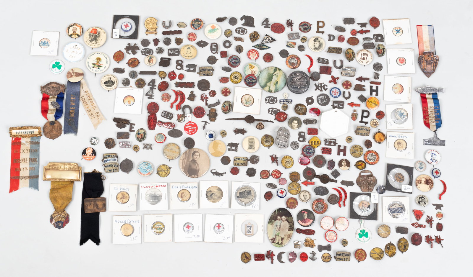 MIXED VINTAGE BUTTONS + PINS: A large collection of assorted vintage buttons and pins. uncounted but probably over 100 pieces.