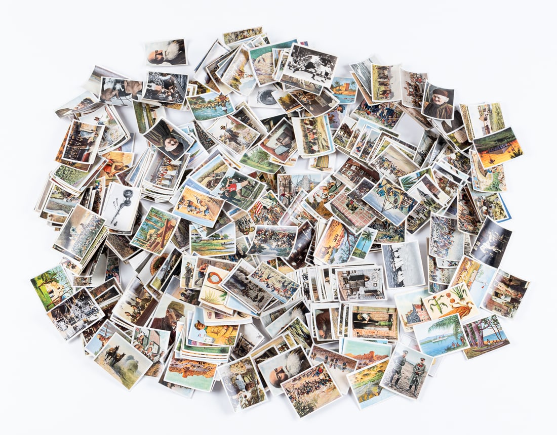 LARGE COLLECTION OF GERMAN CIGARETTE CARDS: Large collection of German cigarette cards from different cigarette albums, contains German history, German colonies, post-war, etc. Uncounted approx. 200 cards. 2 x 2.25 inches.