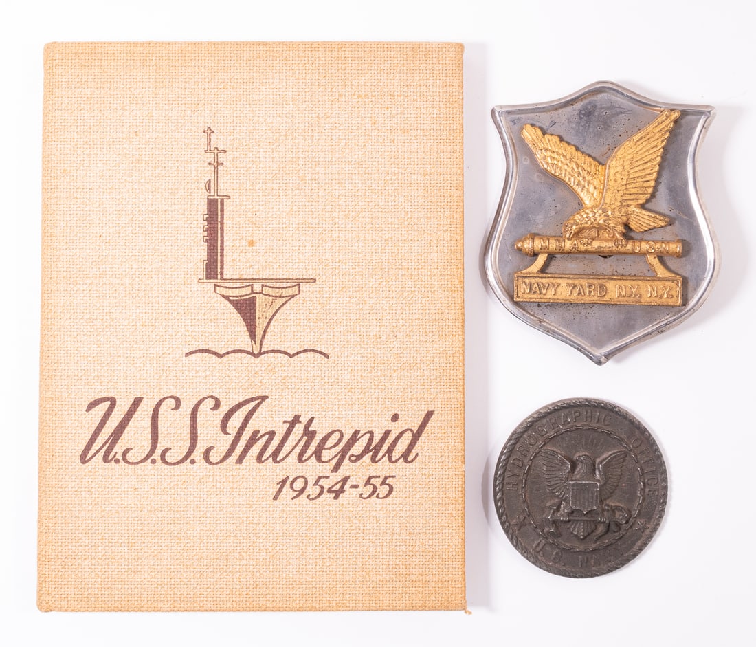 U.S.S. INTREPID RELICS: Three U.S. Navy Korean War items. The first is a yearbook for the U.S.S Intrepid for 1954-1955. The book is heavily illustrated and tells the years story of the U.S.S. Intrepid. The name of the previo