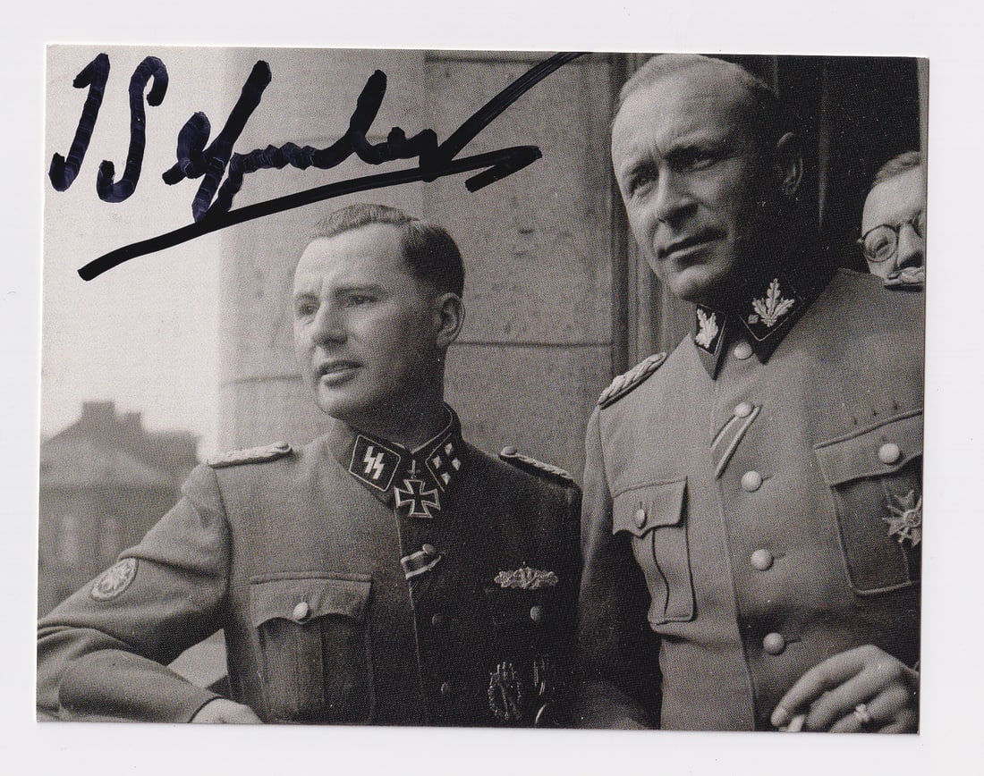 LEON DEGRELLE: (1906-1994) SS-Standartenfuhrer, political leader of the Walloon Legion, recipient of the Knight's Cross of the Iron Cross with Oak Leaves. Signed photograph, Degrelle is on the left with his signatur