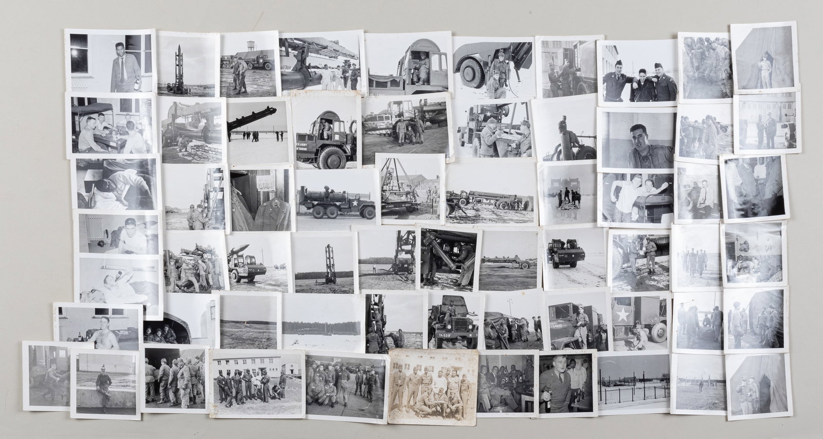 KOREAN WAR MISSLE PHOTOS: Sixty-three b/w photos of Korean War US Army soldiers and ballistic missiles and vehicles, plus some candid of base life. Ca. 3.25 x 4.5 inches each.