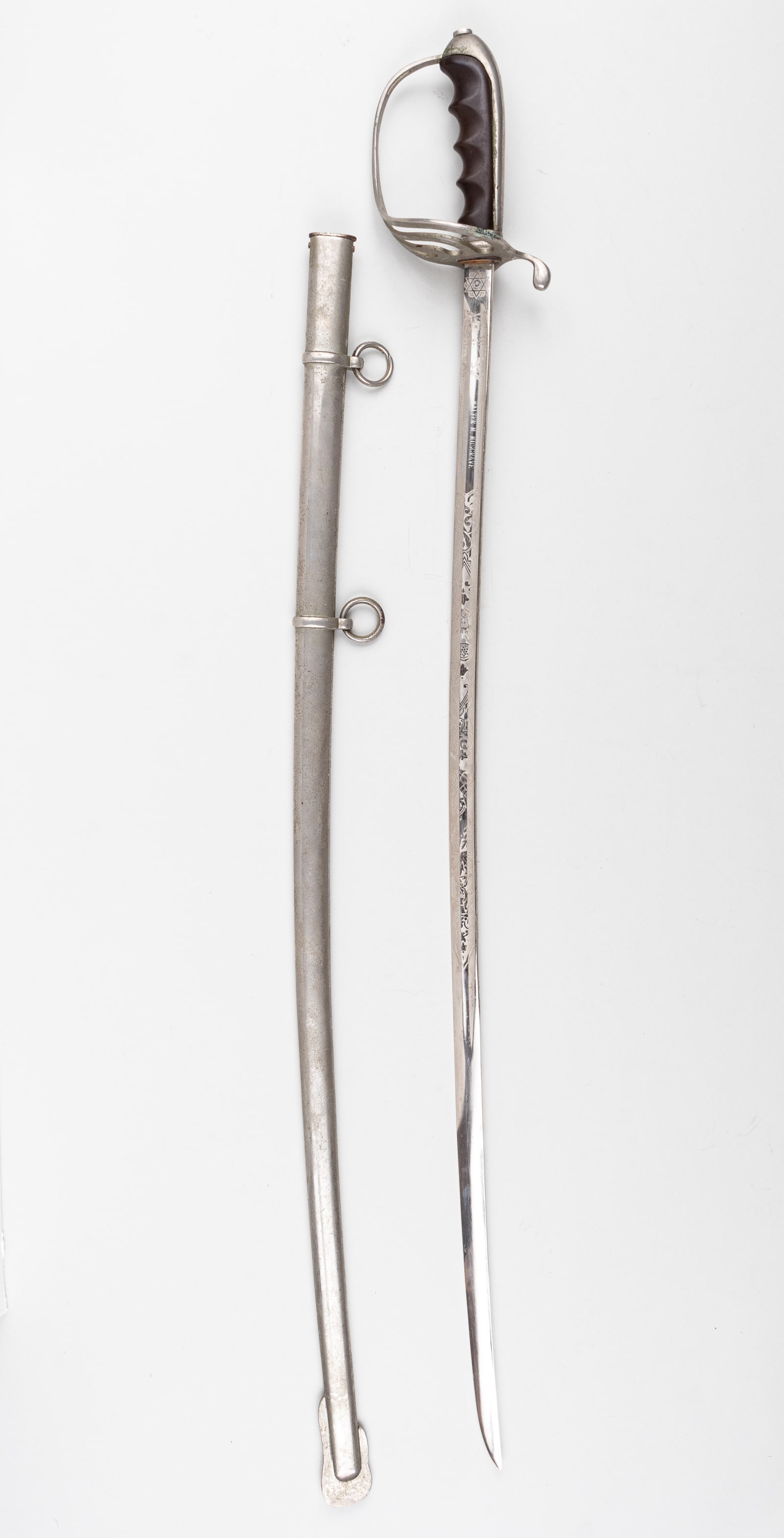 VIETNAM PARADE SWORD NAMED: U.S. parade sword belonging to Walter M. Musgrave. Fine etched decoration, dated August 14, 1967. Features 16 inches of fine etching on both sword faces with an eagle, stars, and torch at the top. 4.5