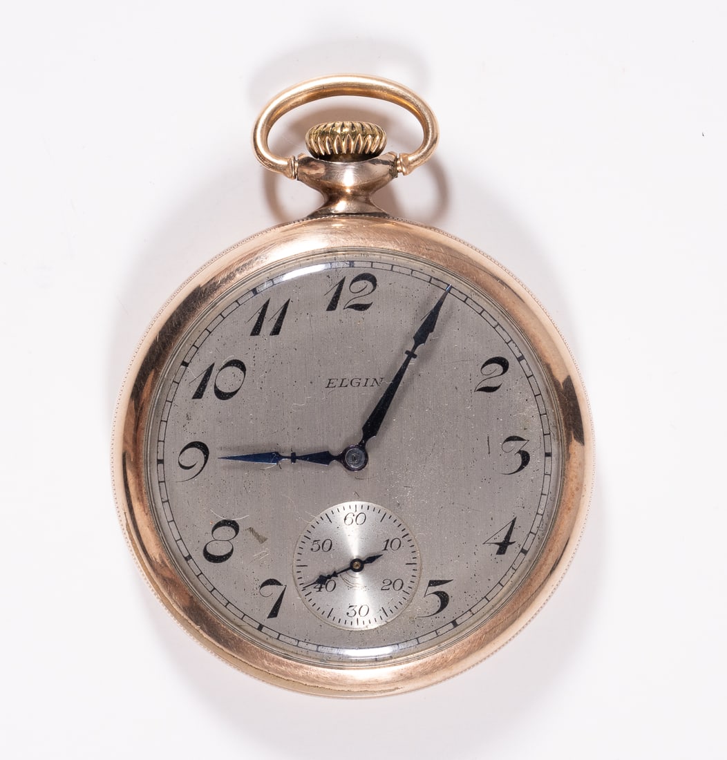 ELGIN 10K POCKET WATCH: Elgin 15 Jewels brass open face pocket watch, 1925-1926. In working order. 2 inches in diameter, and 2.5 inches tall. Minor wear on back. 10K Gold filled, movement serial number 28664233.