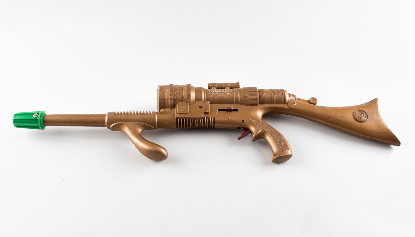 GOLD MARX CAPTAIN SPACE SOLAR SCOUT GUN: Gold Marx Captain Space Solar Scout Gun. Gold color with green tip and gold color. Approx. 27 inches long, with a compartment for two batteries. Functionality is untested. No box.