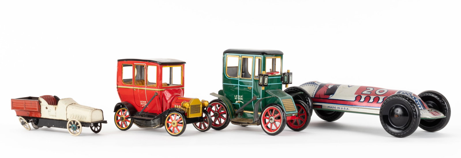 LOT OF FOUR VINTAGE TIN FRICTION TOY CARS: Lot of four vintage tin friction toy cars, includes two Modern Toys Lever Action Oldtimers, approx 5.5 inches long each; tin rod action race car, 10.25 inches long; and a tin friction car, 6.25 inches
