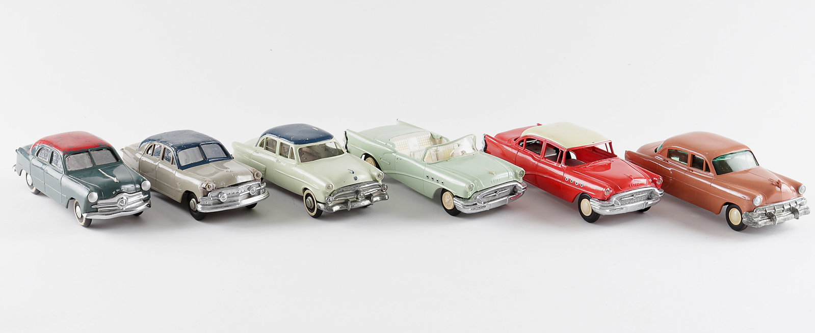 6 PROMOTIONAL SALESMAN SAMPLE CARS: Six wind-up promotional sale sample cars, includes four Buicks including a Buick Century convertible, one Chevy, and one Ford. Two cars have keys. 8 to 7.5 inches long.