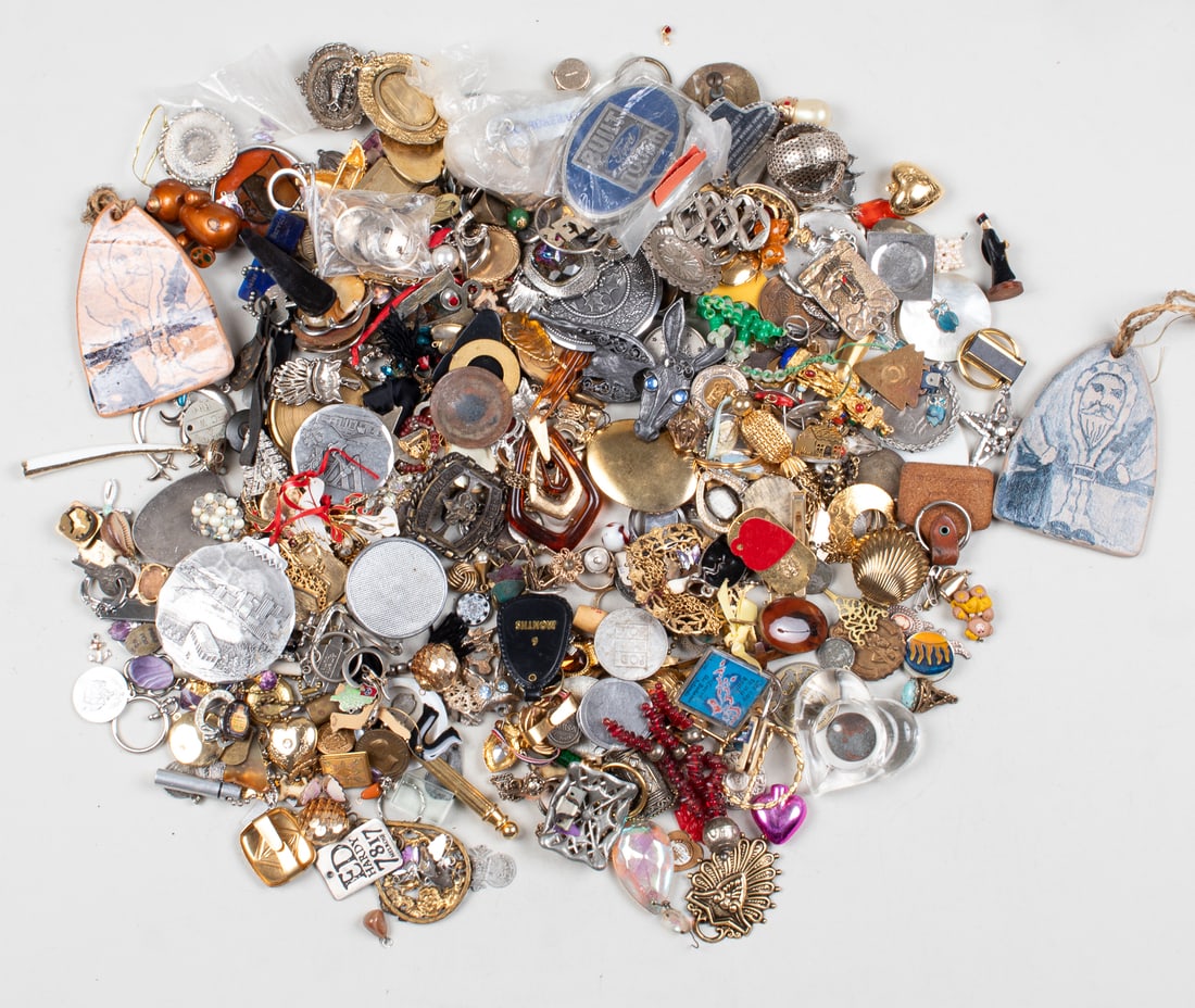 COLLECTION OF COSTUME JEWELRY CHARMS: A collection of costume jewelry charms, weighing 9 lbs.