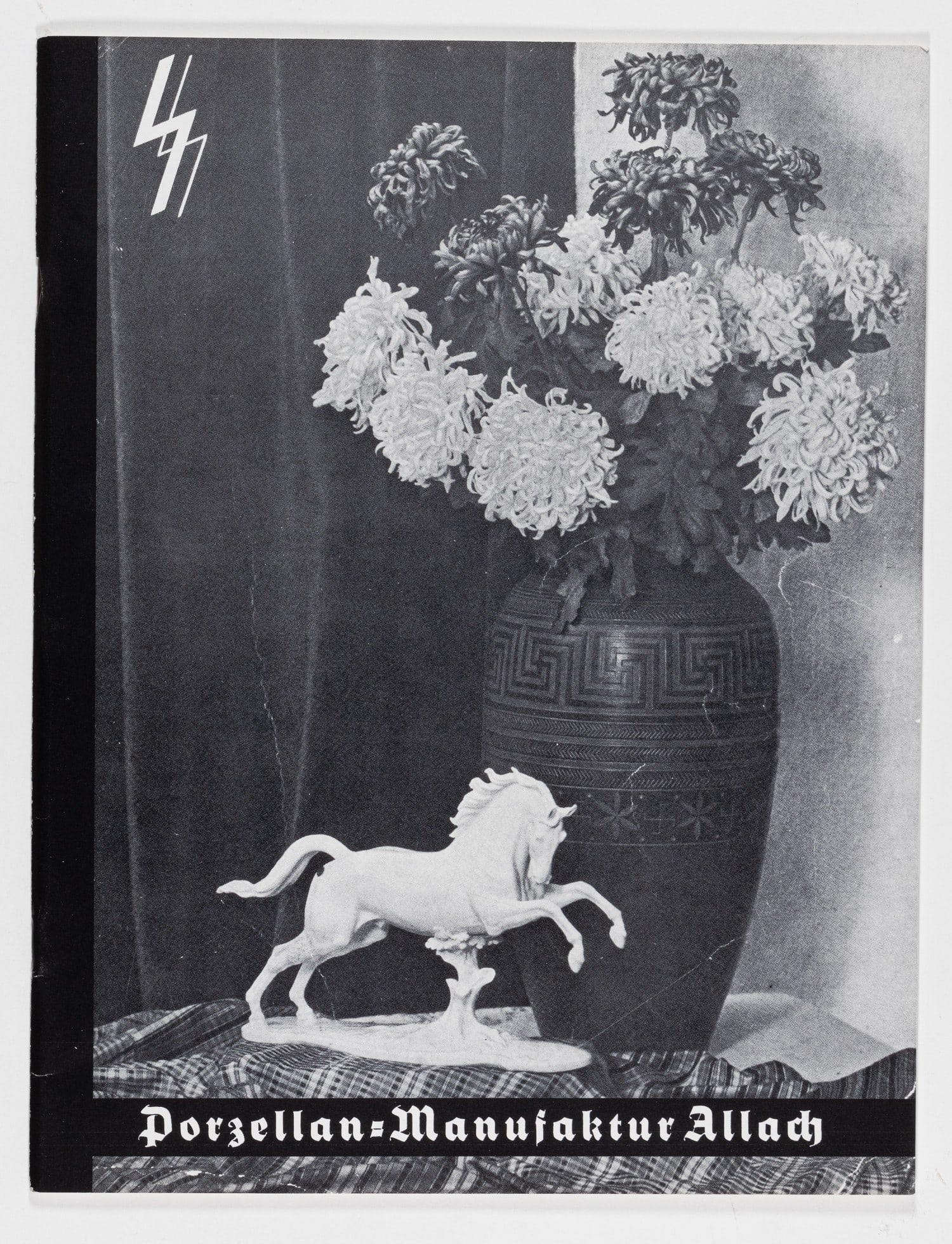 ALLACH CATALOG: Reprint of the scarce SS-Allach catalog, Porzellan-Manufaktur Allach 1938-1939, approx. 48 pages, minor creases on obverse. The catalog features black-and-white photographs and prices of porcelain scu