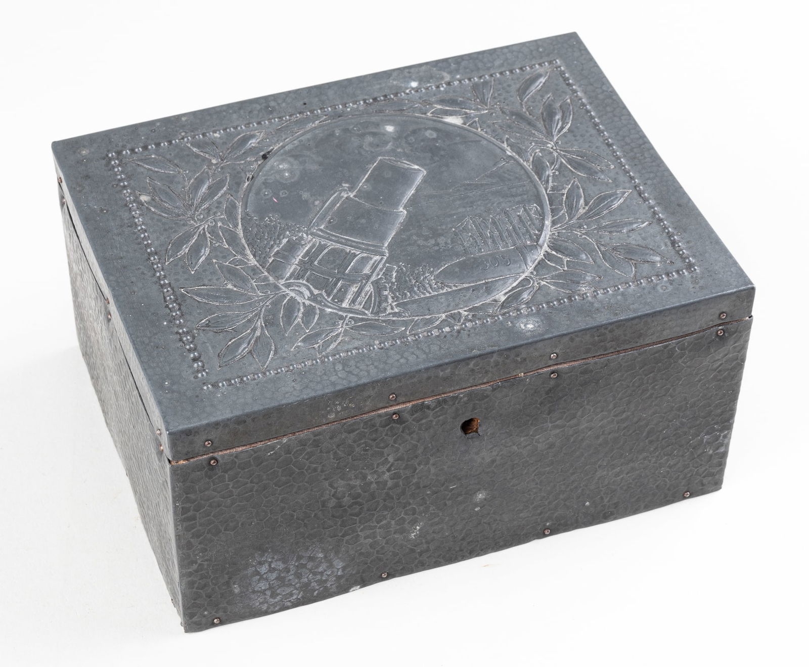 WWI GERMAN COASTAL ARTILLERY CIGAR BOX: WWI Imperial German coastal artillery metal cigar box, featuring an engraving of a heavy German artillery cannon on the coast, with a shell stamped 305. White linen bedding inside case, the exterior i