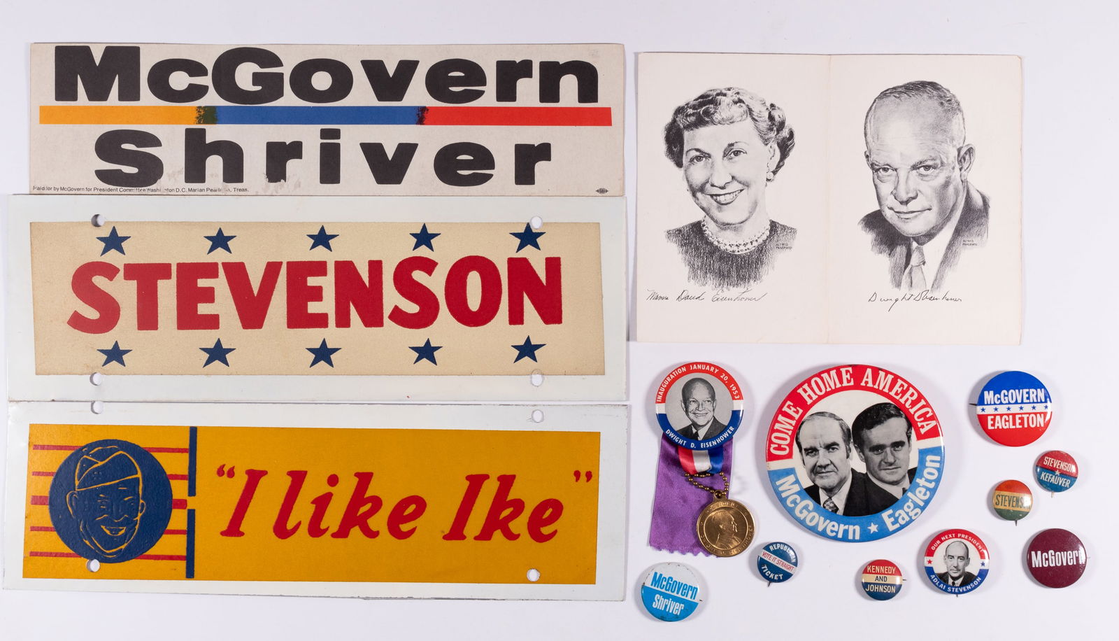 1950s AND 1960s CAMPAIGN MEMORIBILIA: 2 Eisenhower buttons, featuring an inauguration button from 1953 and 'I like Ike' button, one 'I like Ike' bumper sticker affixed to white metal plate. 4 McGovern campaign buttons with one bumper stic