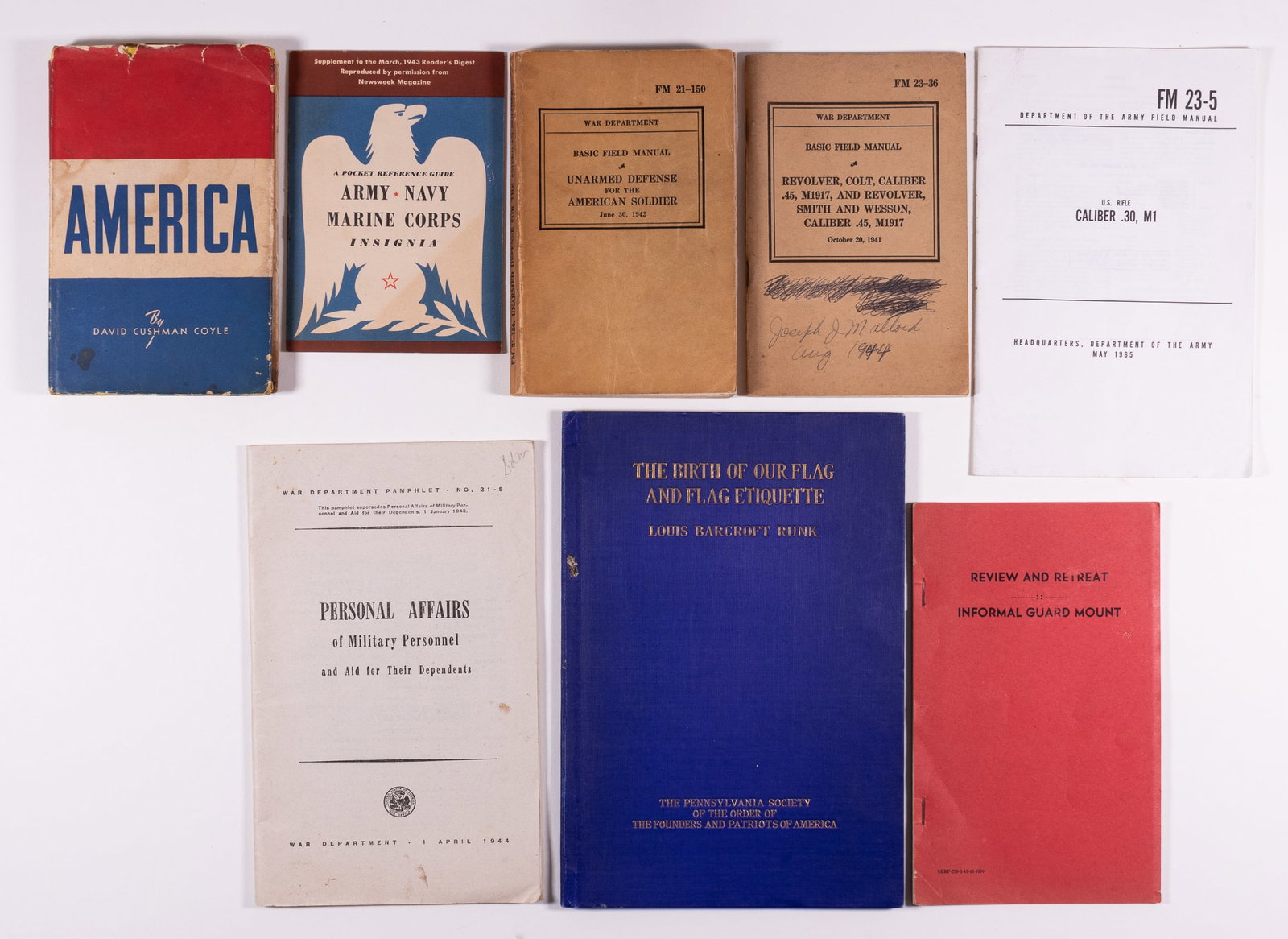 8 WWII US FIELD MANUALS AND BOOKS: Lot of 8 US field manuals and books, one WWII book, six WWII field manuals, and one post-war from 1965. Lot includes The Birth of our Flag and Flag etiquette, Louis Barcroft Runk, 1920; Revolver, Colt