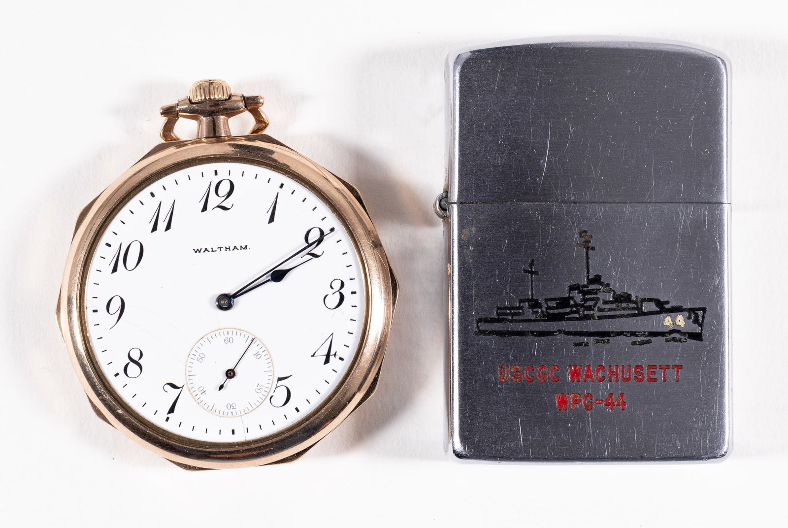 NAMED WWI WATCH AND WWII LIGHTER: WWI dated watch with an inscription on the back that reads 'Presented to - Past - Dept. Commander Jim B. Calahan - by - 11th Annual Encampment Denver 1918.' Waltham gold-filled pocket watch missing fr