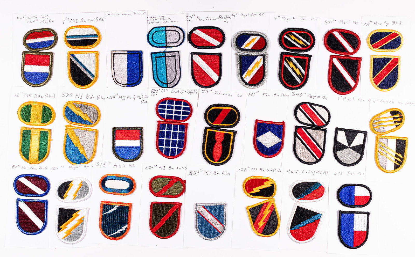 47 US ARMY BATTALION PATCHES: 47 United States Army Battalion patches, all affixed to card and identified, featuring; 1) two 525th Military Intelligence Battalion patches. 2) two 14th Military Intelligence Battalion patches. 3) tw