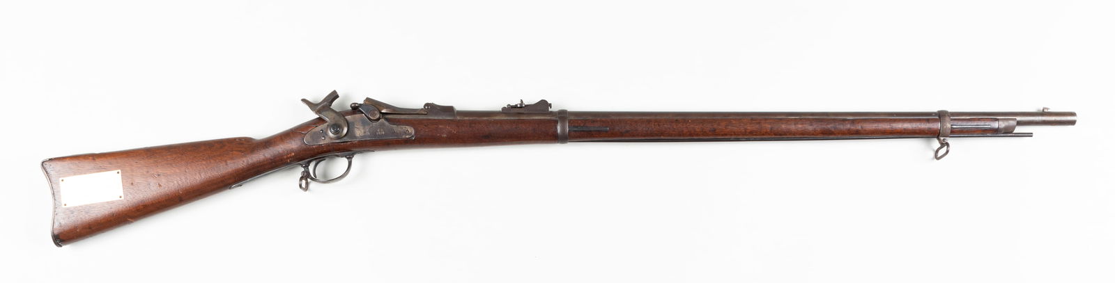 SPRINGFIELD MODEL 1884 TRAPDOOR: Springfield Model 1884, known as the 'Springfield Trapdoor,' was designed as the replacement rifle for the U.S. Armed Forces. The serial number reads '1555...2,' one digit illegible due to corrosion.